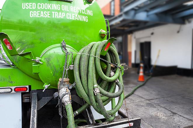 large truck pumping grease trap at a restaurant in Boulder Creek